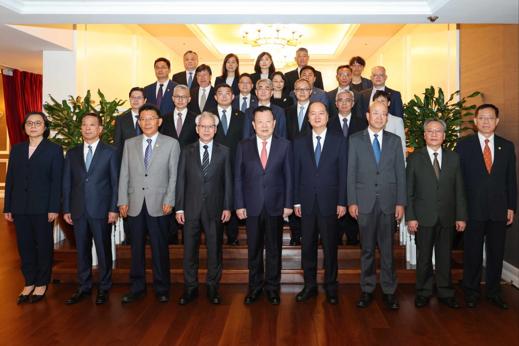 Xia Baolong (front row, centre) met Macau Chief Executive Sam Hou-fai (front row, fourth left) and other officials on Thursday. Photo: Hong Kong and Macau Affairs Office