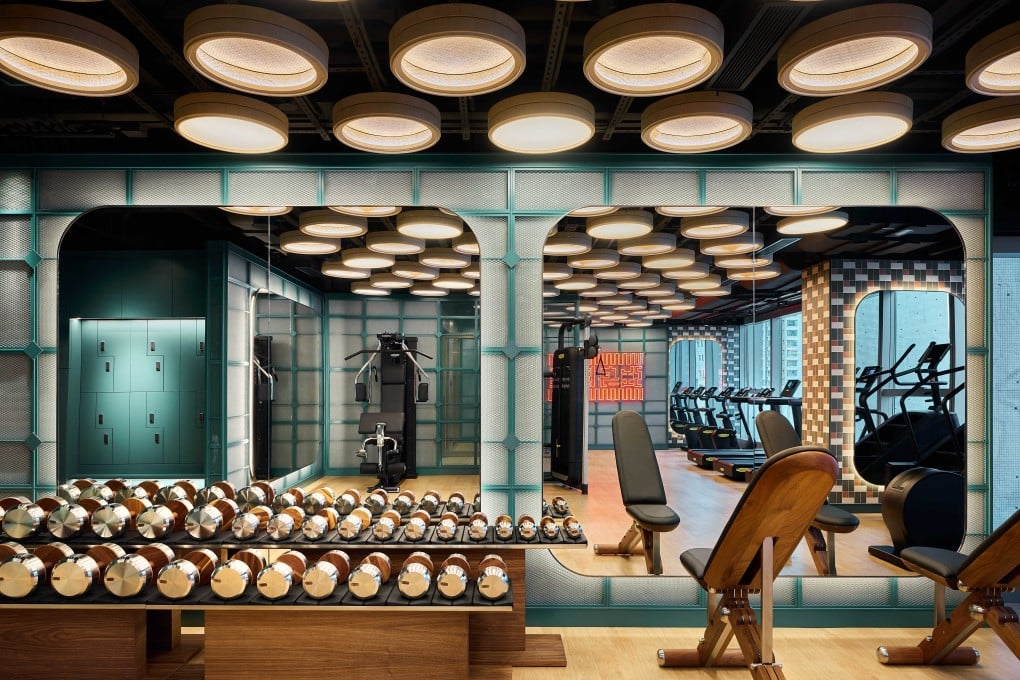 Bamboo steam baskets make light fixtures in the gym at One Bedford Place, Tai Kok Tsui. Photo: Han Tang