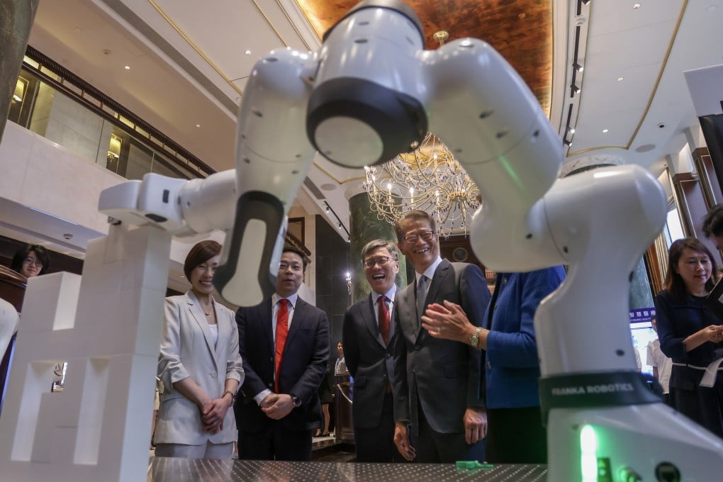 Robot technology is displayed during the Von Neumann Institute’s inauguration ceremony attended by Financial Secretary Paul Chan (third from left). Photo: SCMP
