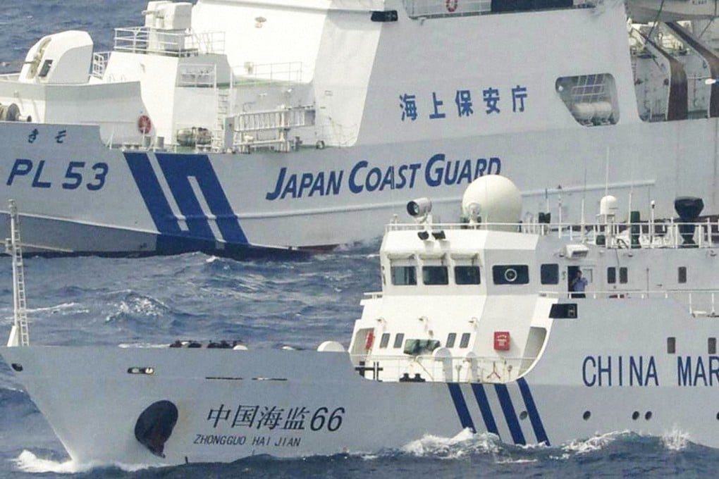 A Japanese coastguard ship sails near a Chinese marine surveillance vessel near the Diaoyu Islands, referred by Japan as Senkaku Islands. Photo: Kyodo News Stills via Getty Images