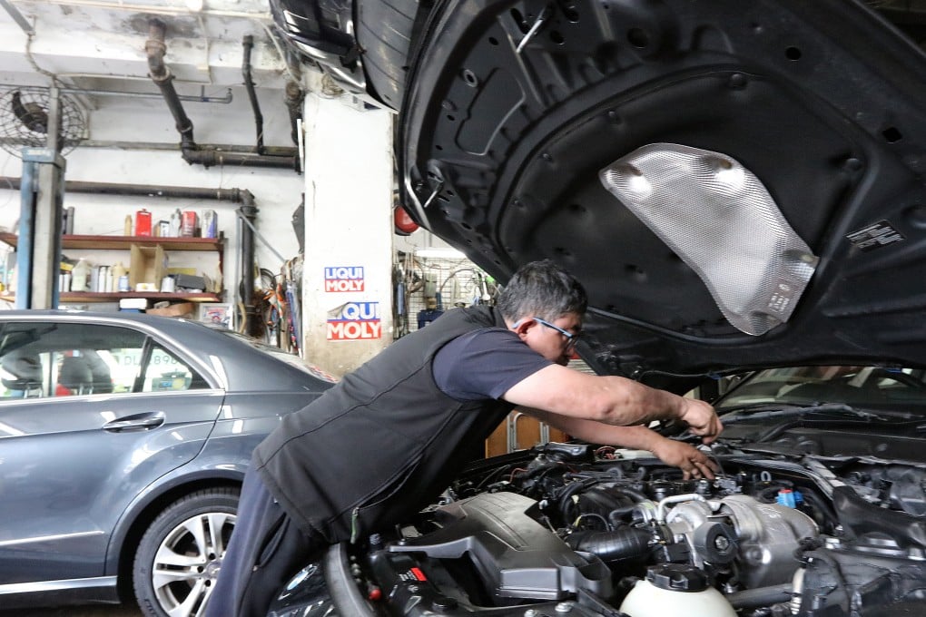Traditional car repair businesses are suffering because of the rise of EVs, a garage owner says.
