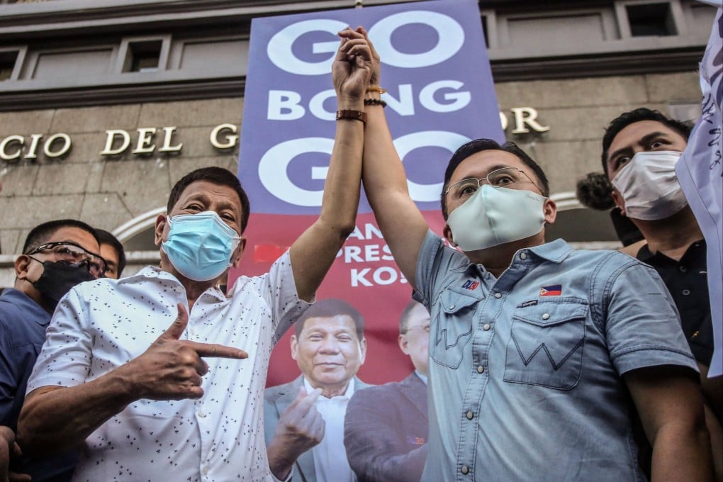 Philippine Senator Christopher “Bong” Go with Rodrigo Duterte (left) in Manila in 2021. Photo: AFP