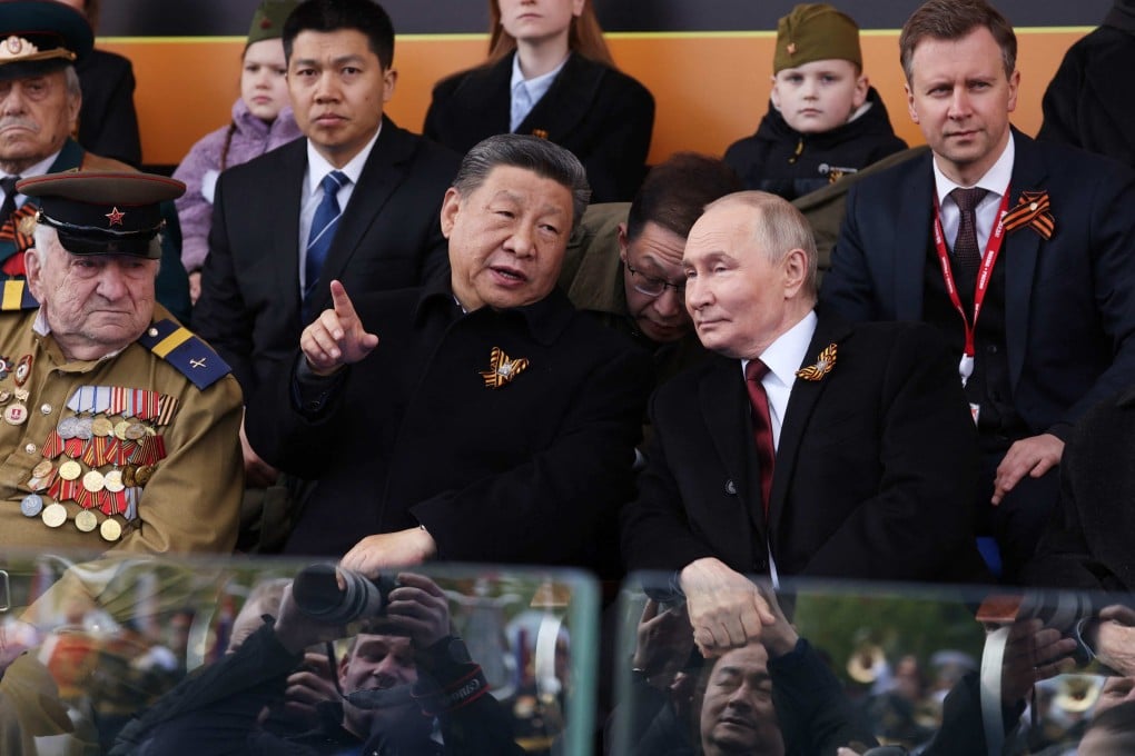 Russian President Vladimir Putin and Chinese President Xi Jinping attend the Victory Day military parade on Red Square in Moscow on May 9. Photo: Pool/AFP