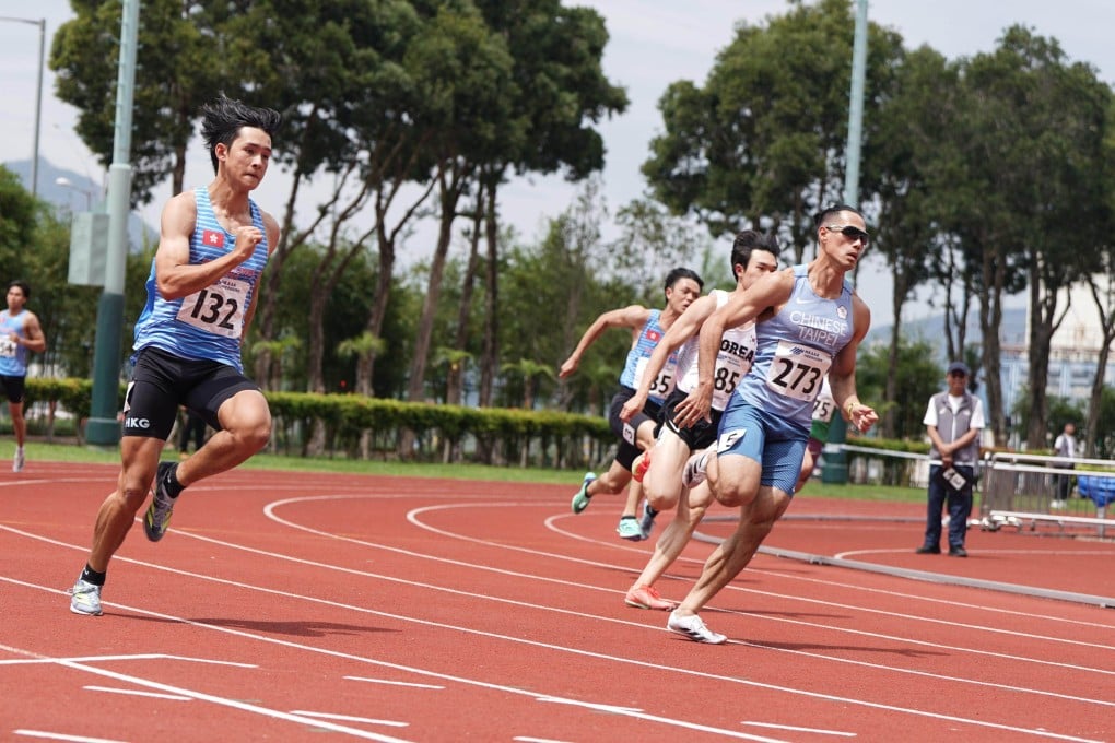 Yang Chun-han (right) runs in the 200m at the Hong Kong Athletics Championships on Sunday. Photo: Mike Chan