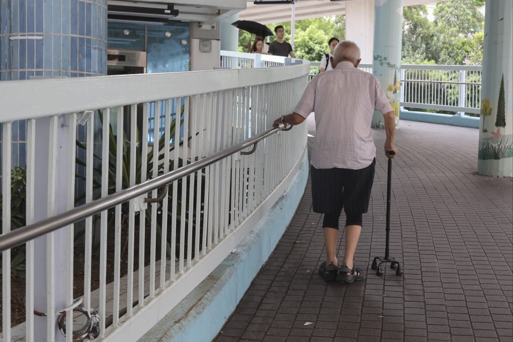 An elderly resident makes his way up a sloping walkway at a park in Mong Kok. Photo: Edmond So