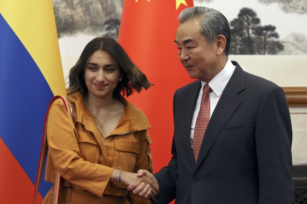 Chinese Foreign Minister Wang Yi and Colombia’s Foreign Minister Laura Sarabia shake hands before their meeting in Beijing, China on Monday. Photo: EPA-EFE
