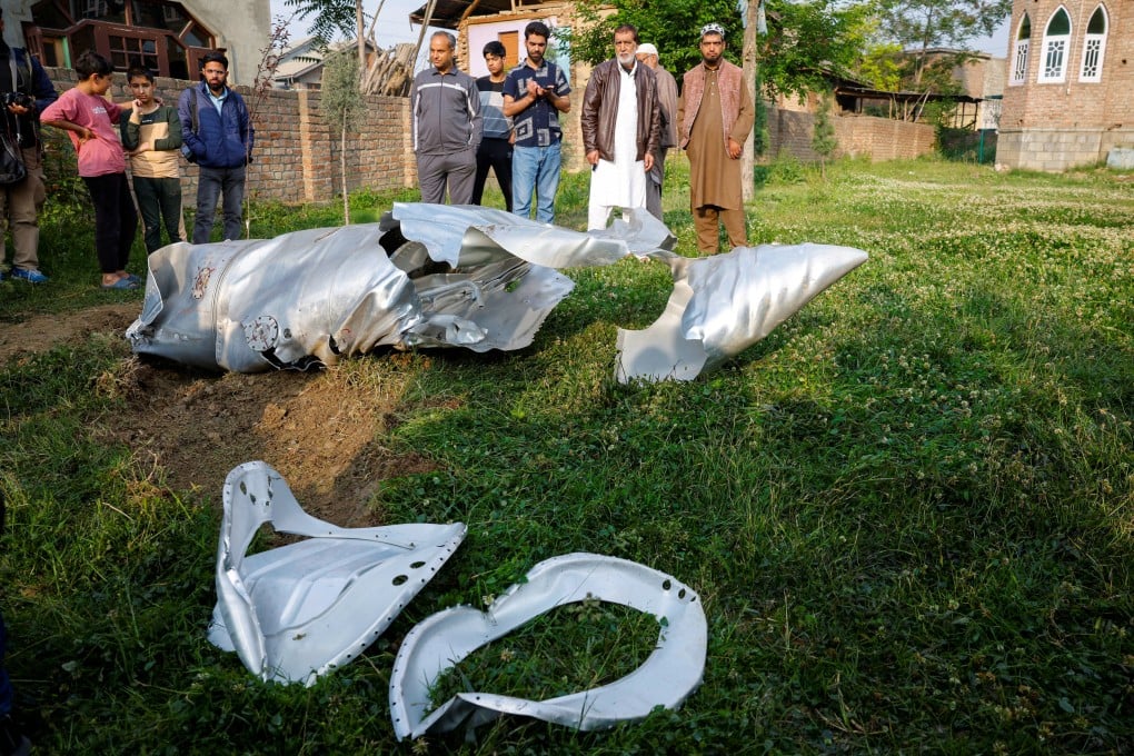 Metal debris is seen on the ground in Kashmir on Wednesday. Pakistan claimed to have shot down French Rafale fighter jets operated by India’s air force with a Chinese-made J-10C aircraft. Photo: Reuters