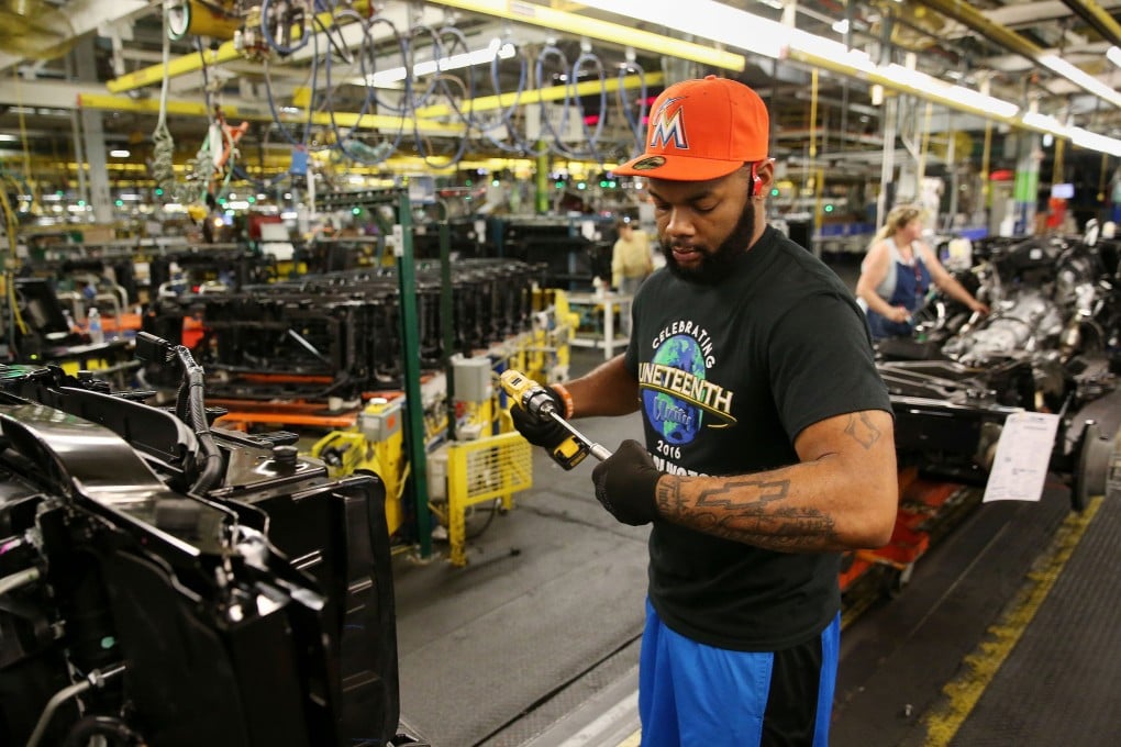 Employees work at a car factory in Arlington, Texas. Photo: The Dallas Morning News/TNS