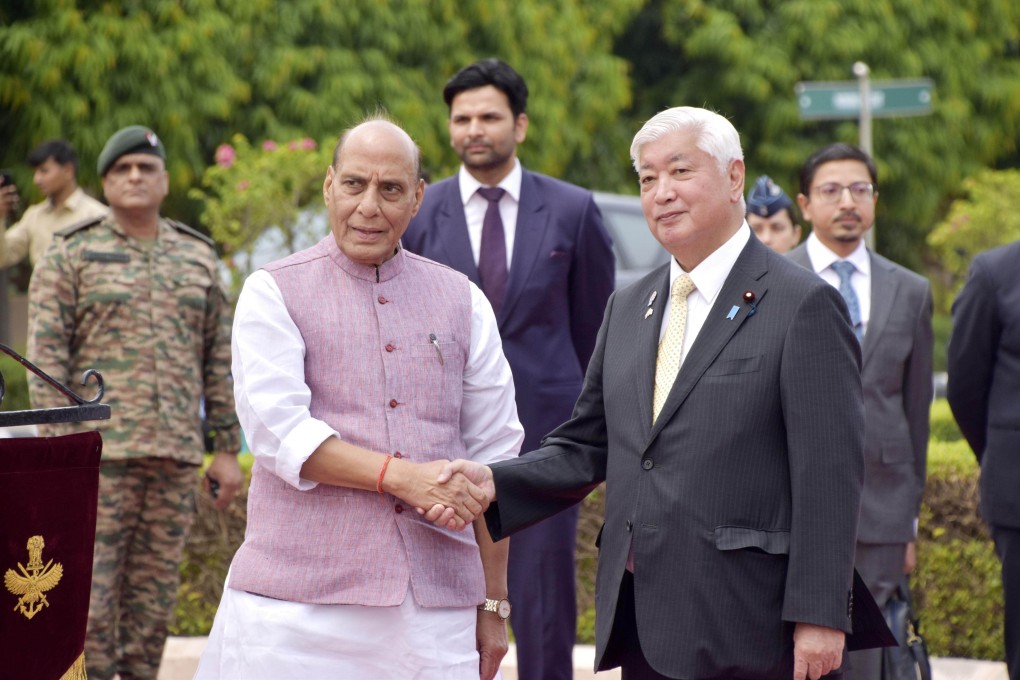 Indian Defence Minister Rajnath Singh and his Japanese counterpart Gen Nakatani shake hands before their talks in New Delhi on May 5. Photo: Kyodo