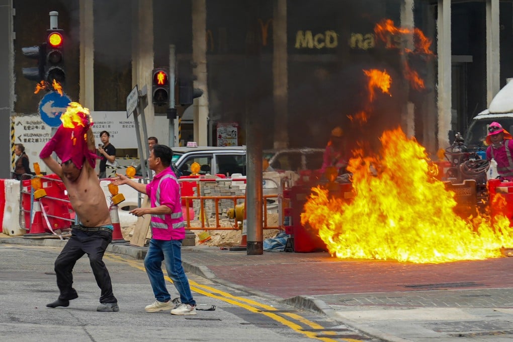 Sam Tsang’s shot of a construction worker’s clothing catching fire after an accident in Kwun Tong won the Breaking News category. Photo: Sam Tsang