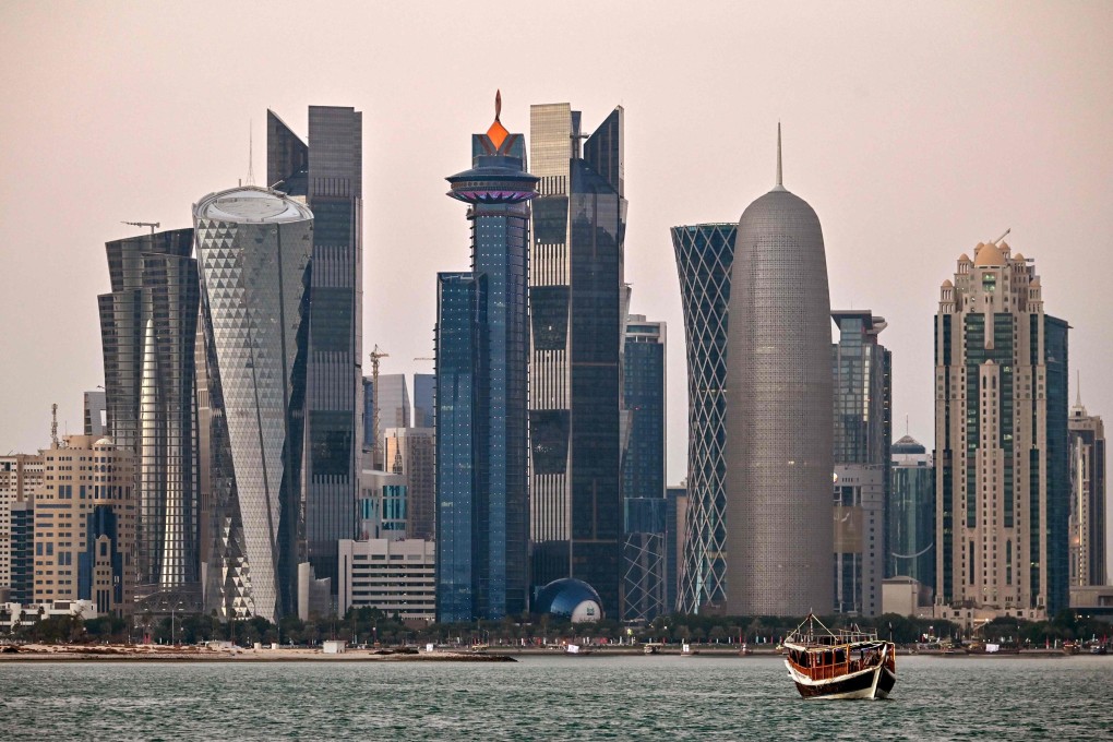 Boats moored in front of high-rise commercial buildings in Doha, the capital of Qatar. Photo: AFP