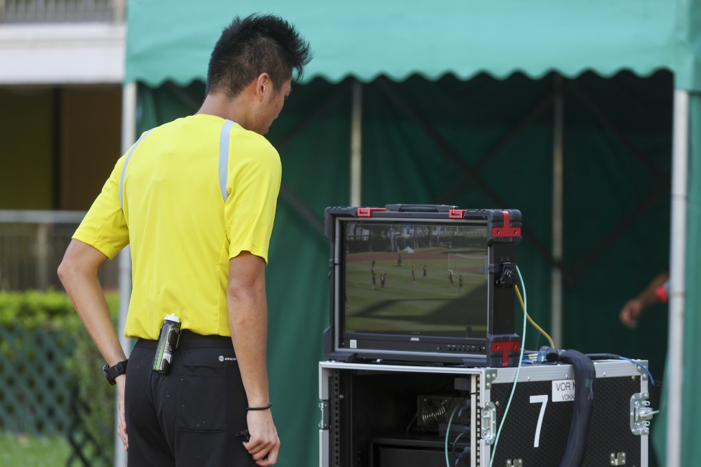 A referee reviews footage of an incident in a Hong Kong Premier League match. Photo: Edmond So