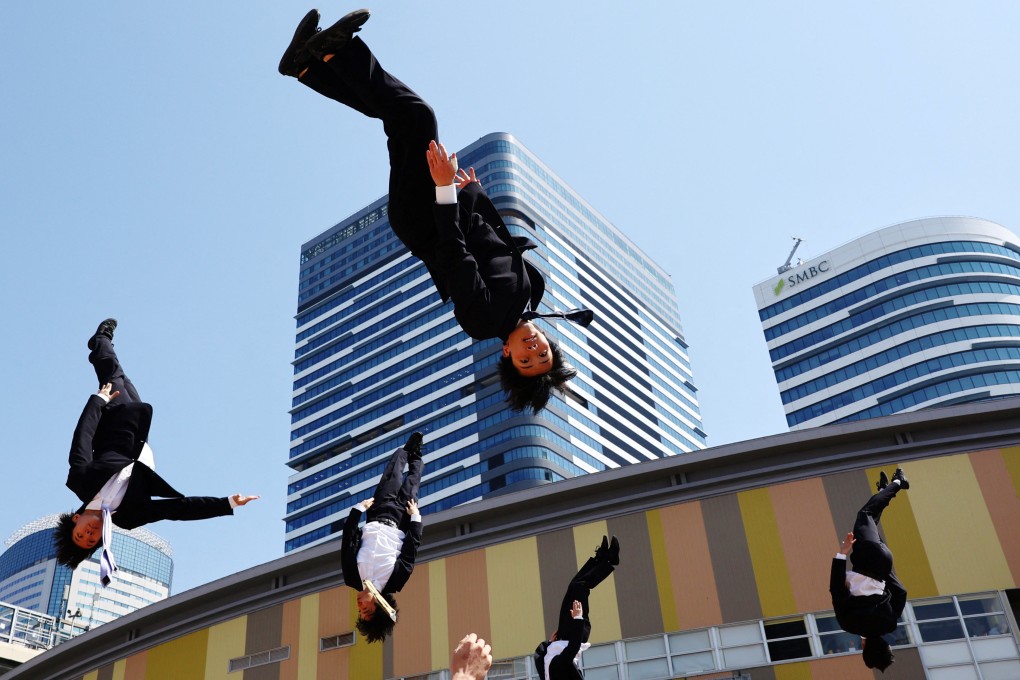 Members of Cheer Re-Man’s, an all-male cheer-leading team of active businessmen, perform at “Cheer Up Japan” in Tokyo in March. Photo: Reuters