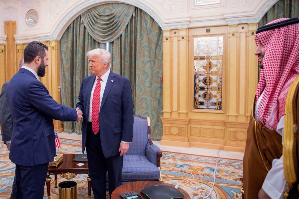 Saudi Crown Prince Mohammed bin Salman (right) watches as US President Donald Trump (middle) meets Syria’s interim President Ahmed al-Sharaa in Riyadh on Wednesday. Photo: AFP/Saudi Royal Palace/Bandar al-Jaloud