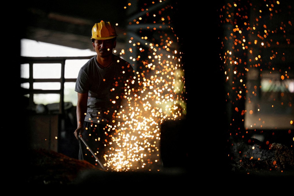 An employee works at a steel processing production line at a factory in Mandi Gobindgarh in the northern state of Punjab, India. Photo: Reuters