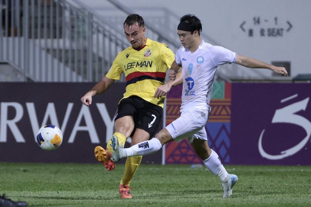 Mitchel Paulissen (left) challenges Nam Dinh’s Nguyen Van Toan during an Asian Champions League Two match last September. Photo: Jonathan Wong