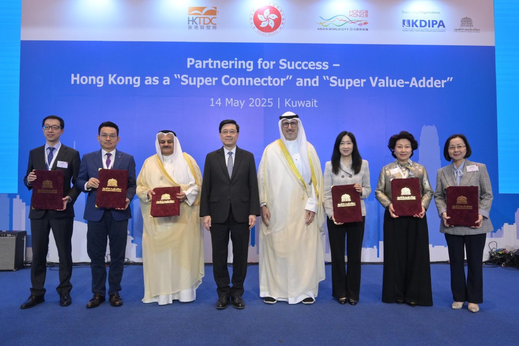 Chief Executive John Lee (fourth from left) at  a business luncheon in Kuwait. Photo: Handout