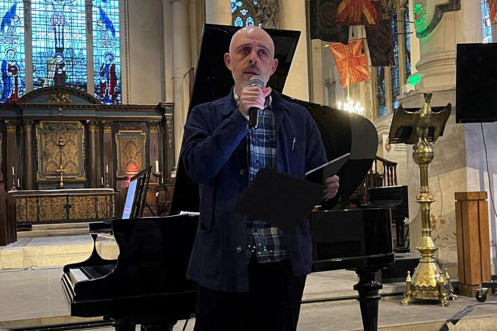 Russian filmmaker Roma Liberov addresses the audience at a concert he organised in memory of Pavel Kushnir, a pianist who died in a Russian prison in 2024, in a church in London, England, on May 10, 2025. Photo: Reuters