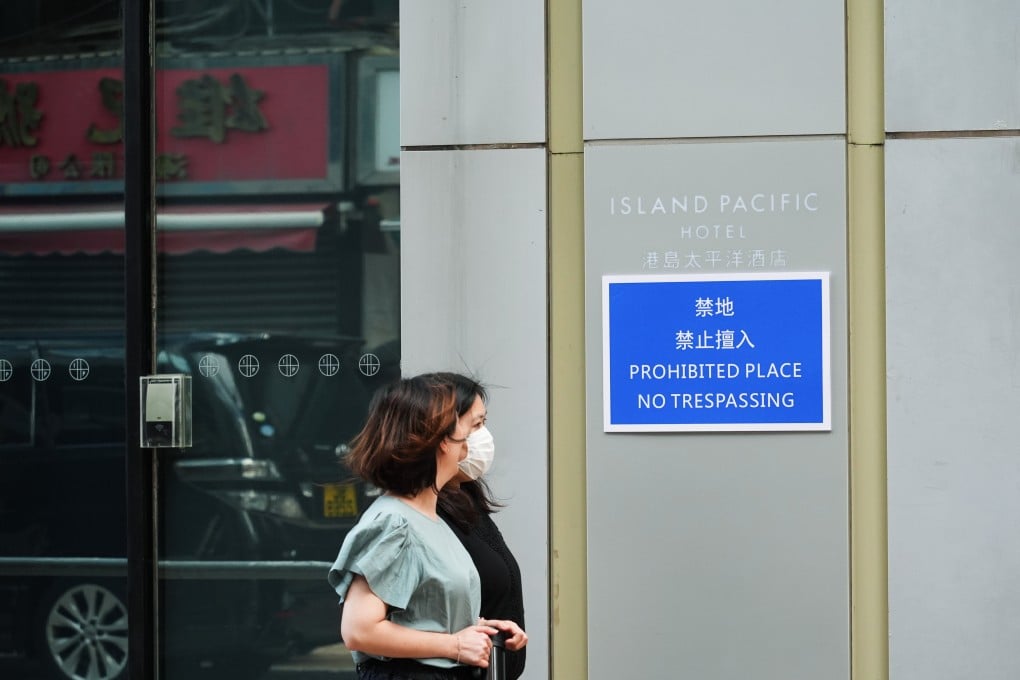 People walk past the Island Pacific Hotel in Sai Ying Pun, one of the six “prohibited places” under subsidiary legislation to the Safeguarding National Security Ordinance. Photo: Eugene Lee