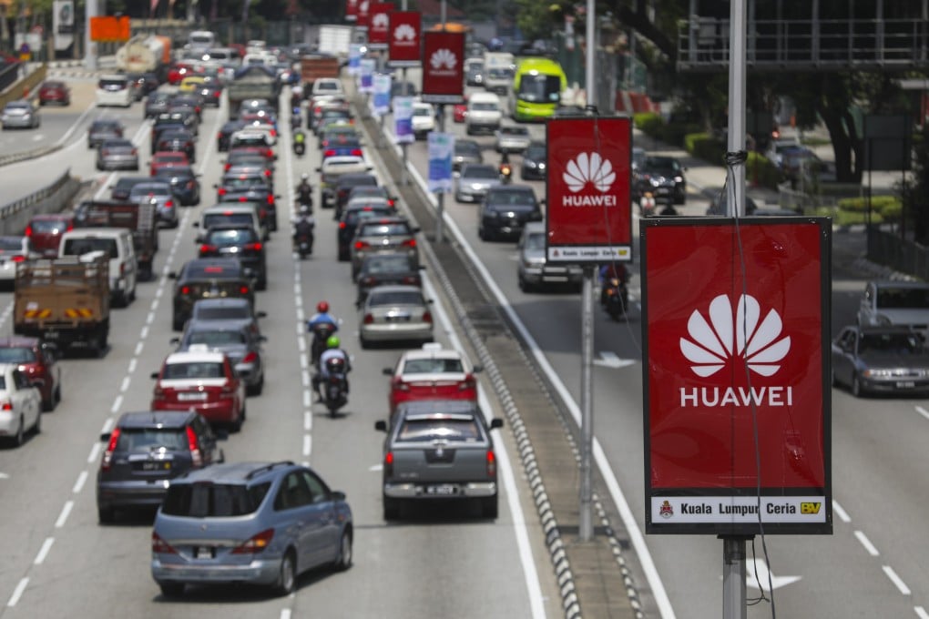 The logo of China’s Huawei Technologies is displayed in the middle of city road in Kuala Lumpur, Malaysia. Photo: EPA-EFE