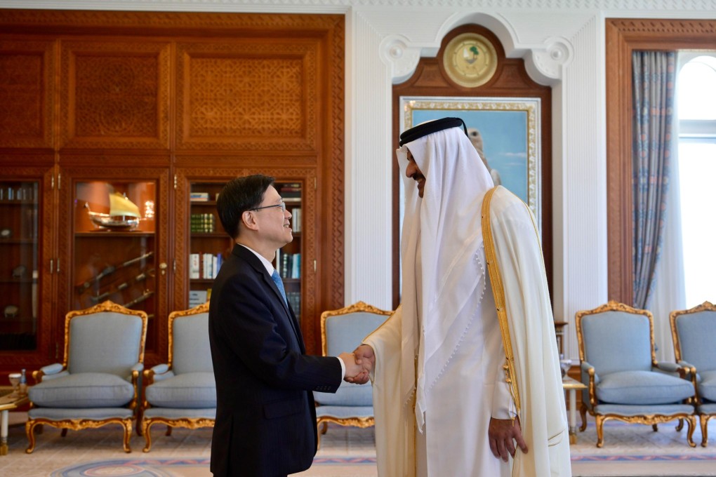 Visiting Hong Kong Chief Executive John Lee shakes hands with Qatar’s head of state Tamim bin Hamad Al Thani on May 11 in Qatar. Photo: Hong Kong’s Information Services Department
