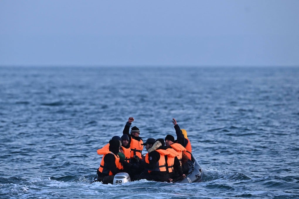 Migrants in an inflatable boat attempt to cross the English Channel. File photo: AFP