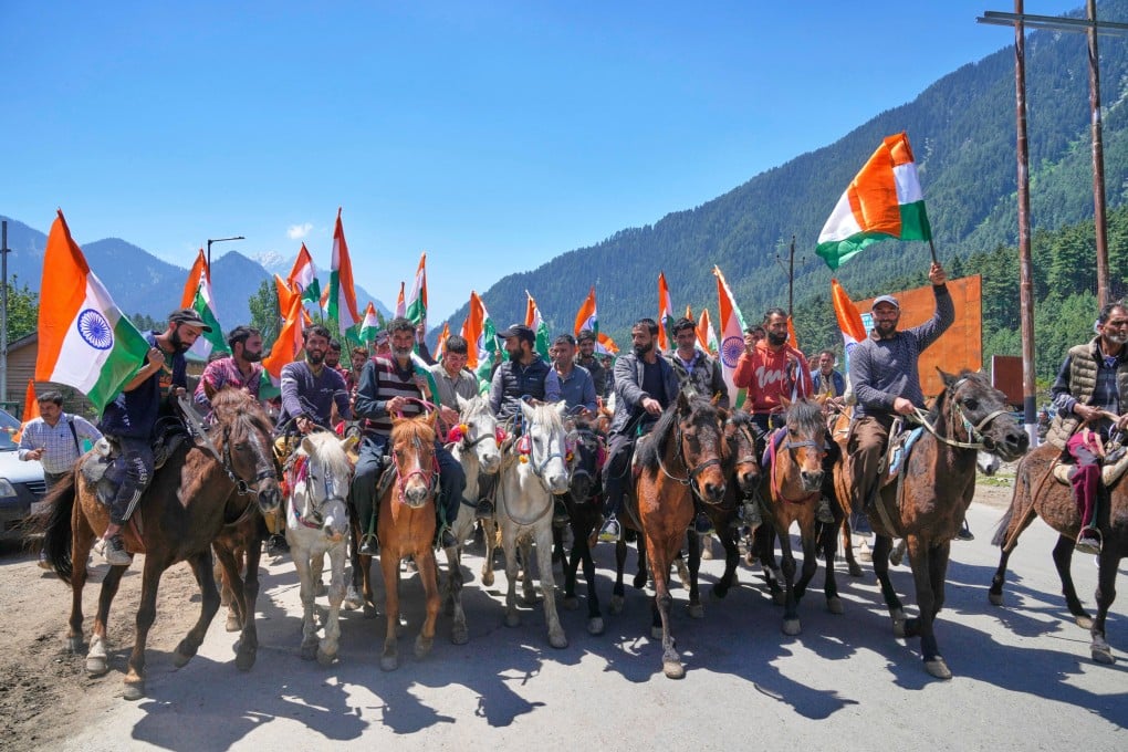 People carry Indian national flags during a tricolour march to support “Operation Sindoor” in Pahalgam, Indian-controlled Kashmir, on Thursday. Photo: AP