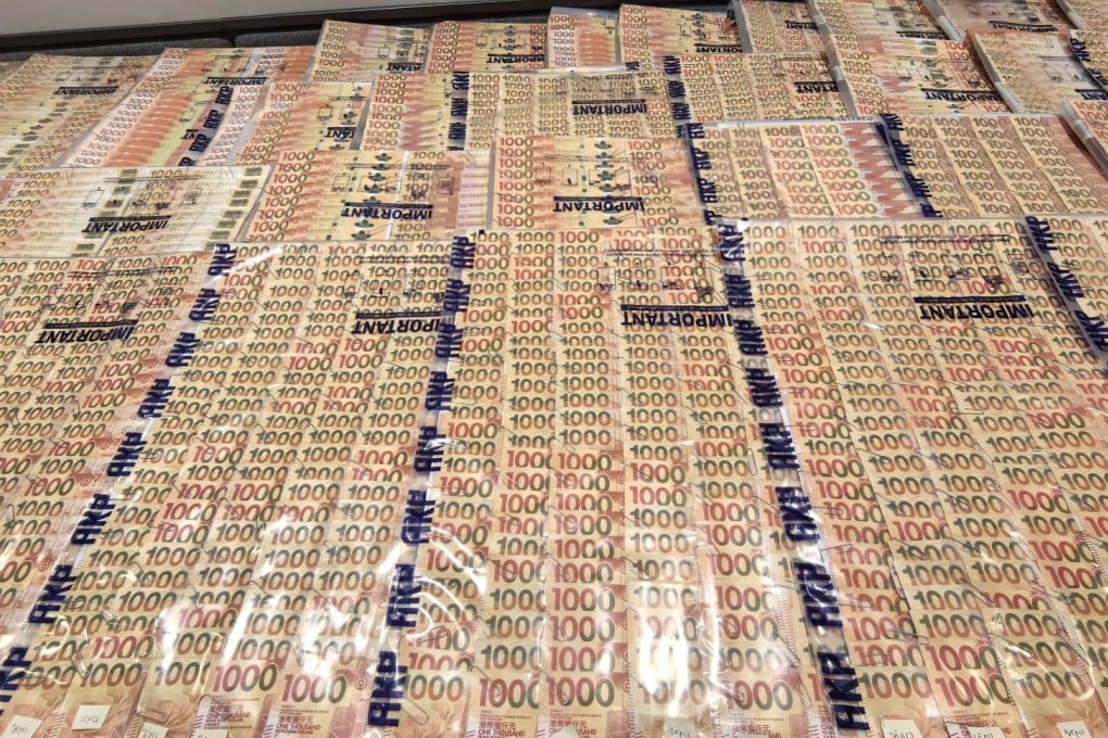 Hong Kong police seized HK$1.6 million in cash during a raid on the syndicate’s premises in Tsuen Wan. Photo: Handout