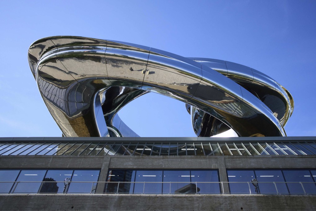 Chinese architect Ma Yansong’s sweeping spiral staircase protrudes from the roof of the Fenix Museum of Migration in Rotterdam, the Netherlands. Photo; AP