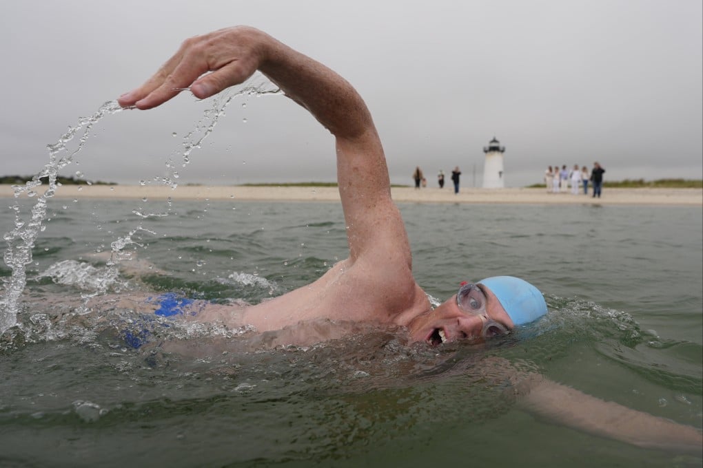Endurance swimmer Lewis Pugh near the Edgartown Lighthouse at the start of his attempt to swim around Martha’s Vineyard, the island in the US state of Massachusetts where scenes for the film Jaws were shot 50 years ago. On land Pugh, 55, will advocate for sharks. Photo: AP