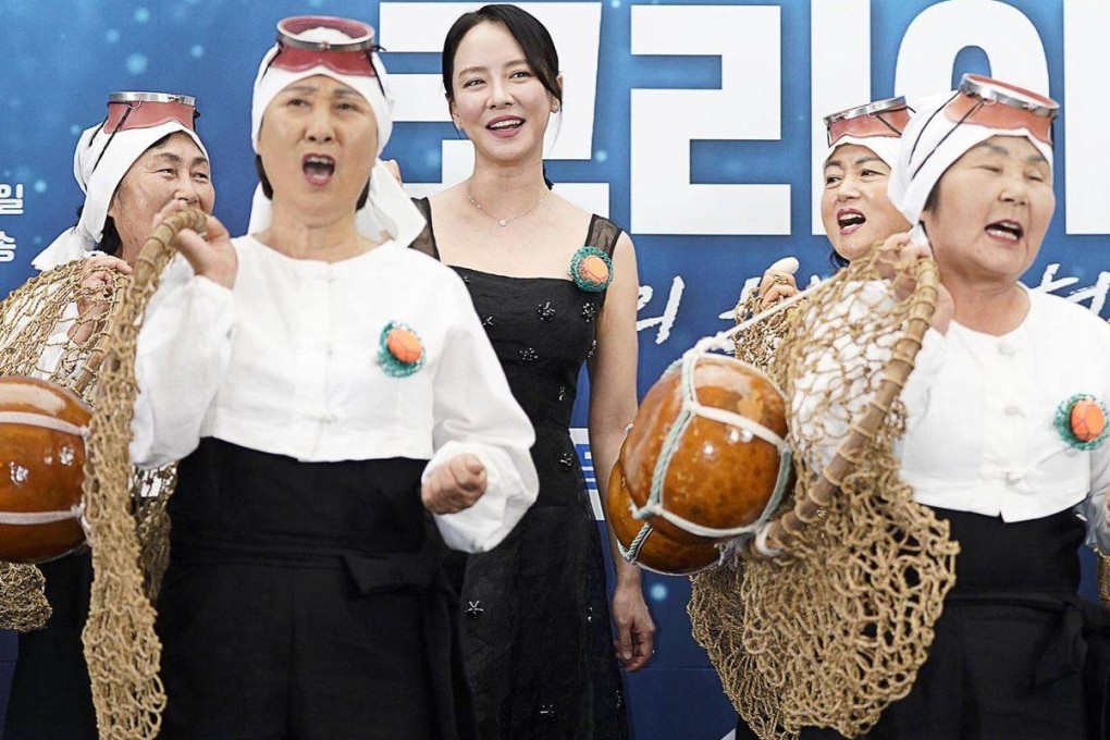 Song Ji-hyo, centre, with a group of traditional female divers during a press conference for Deep Dive Korea: Song Ji-hyo’s Haenyeo Adventure in Seoul. Photo: courtesy of JTBC