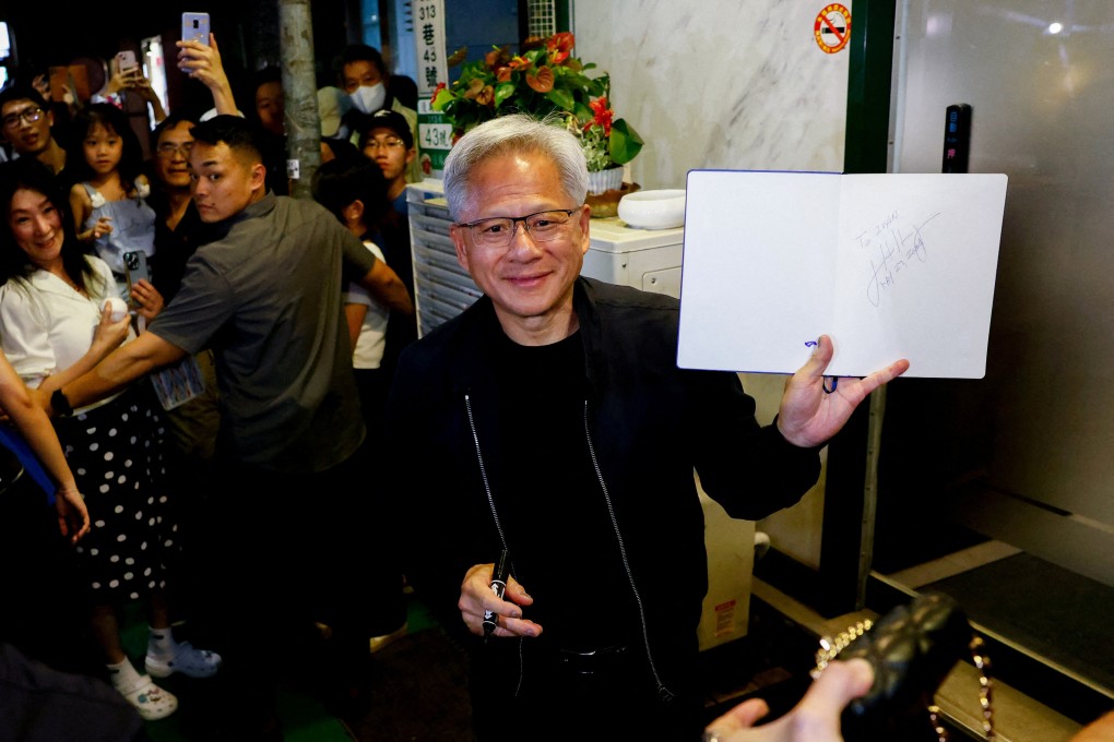 Nvidia CEO Jensen Huang interacts with the media and supporters outside a restaurant in Taipei on May 16. Photo: Reuters