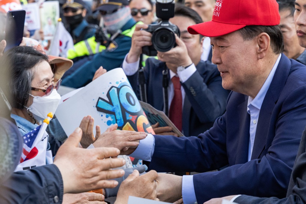 Former South Korean president Yoon Suk-yeol shakes hands with his supporters on April 11. Photo: Kim Jung-yeop