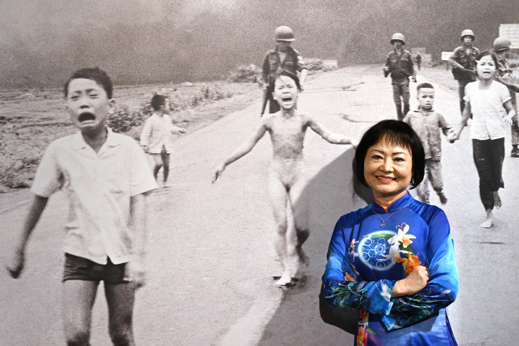 ‘Napalm Girl’ Kim Phuc poses in front of the famous image in Milan, Italy, in May 2022. Photo: EPA-EPE