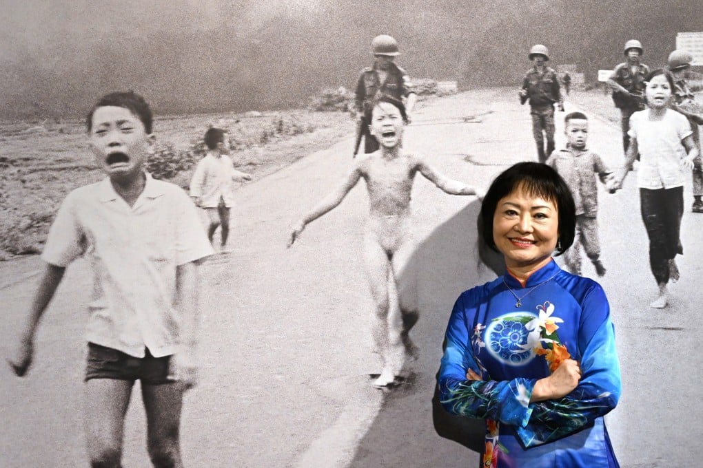 ‘Napalm Girl’ Kim Phuc poses in front of the famous image in Milan, Italy, in May 2022. Photo: EPA-EPE