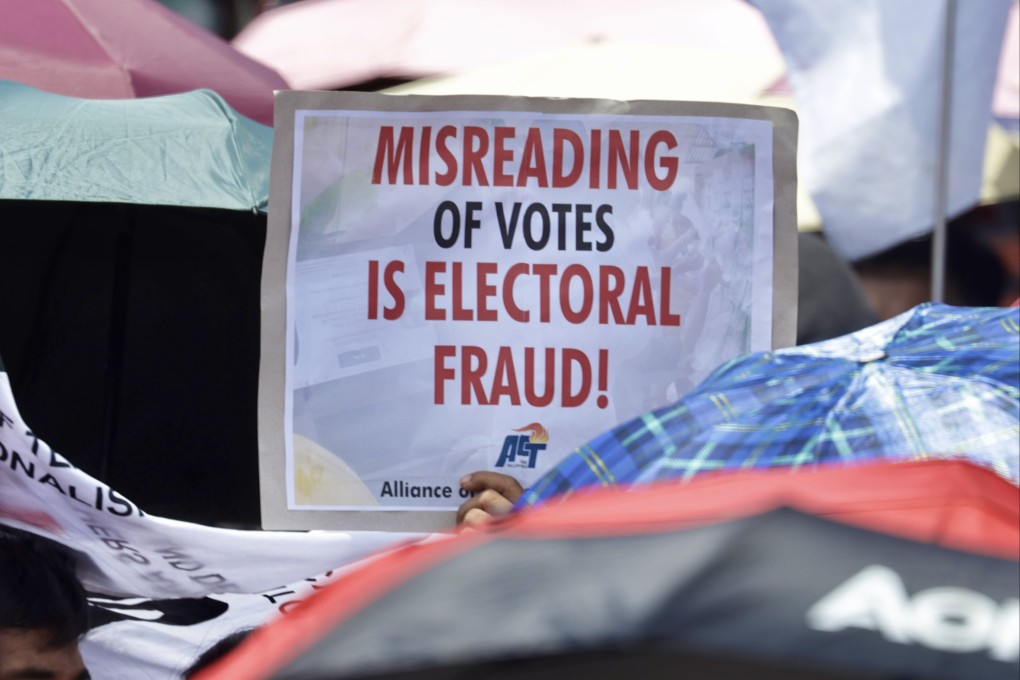 Filipino protesters demonstrate against electoral fraud outside the Commission on Elections (Comelec) office in Manila on Tuesday last week. Photo: EPA-EFE