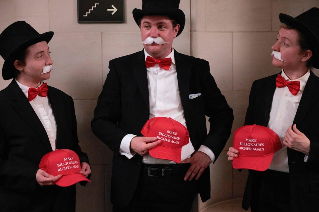 Demonstrators dressed as the Monopoly Man prepare to attend a House Ways and Means Committee Chairman hearing on Capitol Hill on Wednesday. Photo: AFP