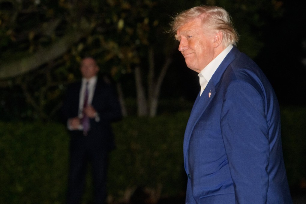 US President Donald Trump walks across the South Lawn upon arrival at the White House on Friday. Photo: AP