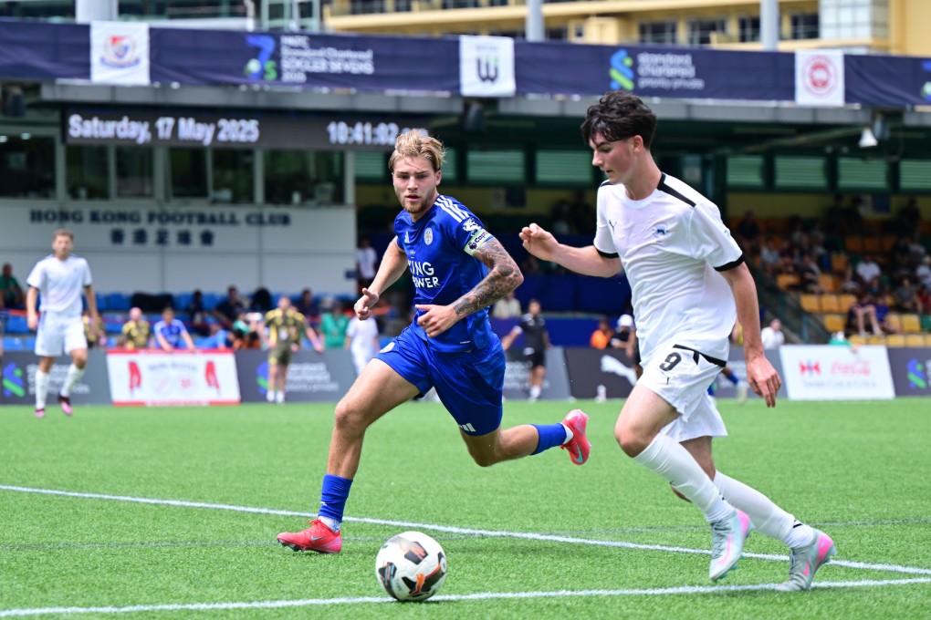 Jack Bennie of Hong Kong Football Club (in white) takes on Leicester City’s Henry Cartwright on Saturday. Photo: HKFC Standard Chartered Soccer Sevens