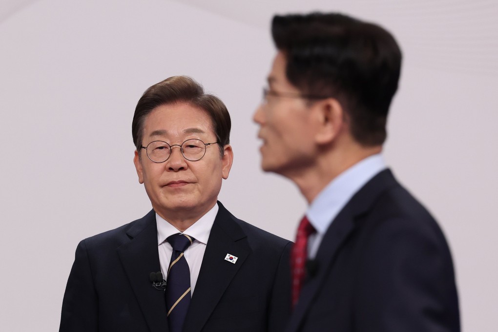 South Korea’s presidential candidates, Lee Jae-myung (left) of the Democratic Party and Kim Moon-soo of the People Power Party, at the televised presidential debate for the forthcoming presidential election, in Seoul, South Korea, on Sunday. Photo: EPA-EFE