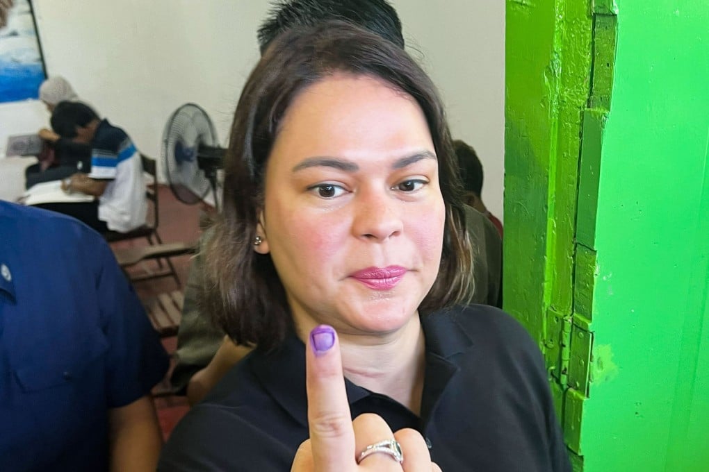 Sara Duterte-Carpio shows her inked finger after casting her vote in the Philippine midterm elections on Monday. Photo: Kyodo
