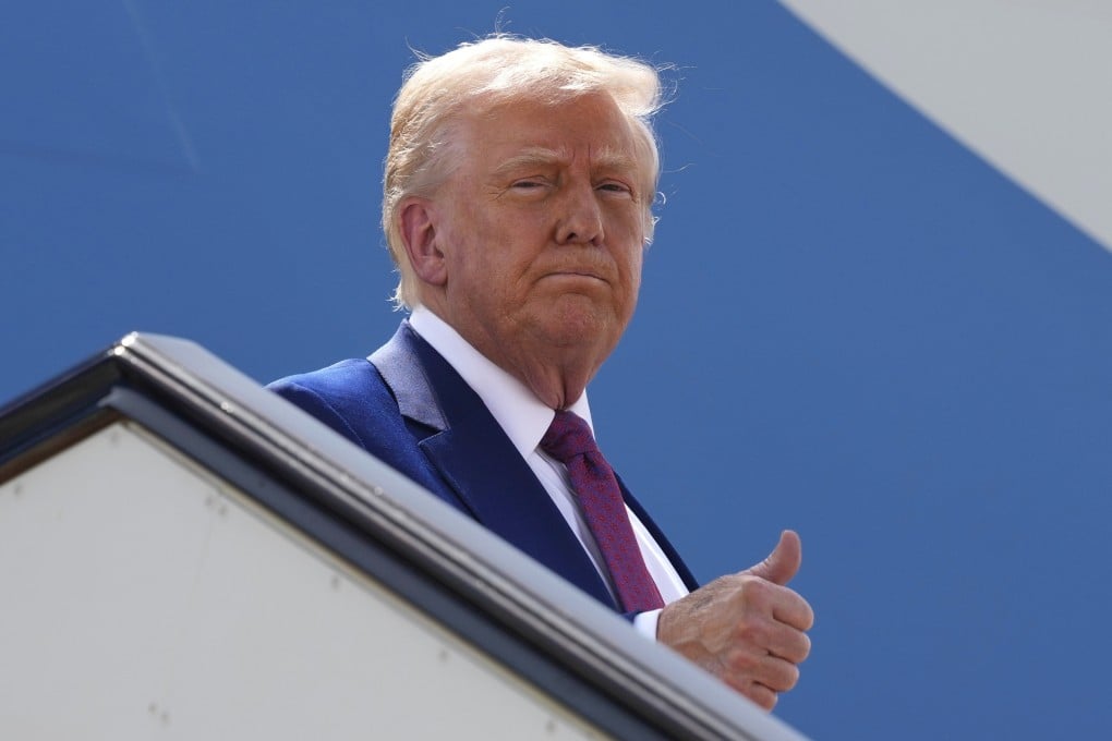 US President Donald Trump gestures as he boards Air Force One on Thursday. Photo: AP