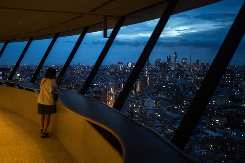 A woman enjoys the skyline of Tokyo, Japan, on August 28, 2024. Photo: AFP
