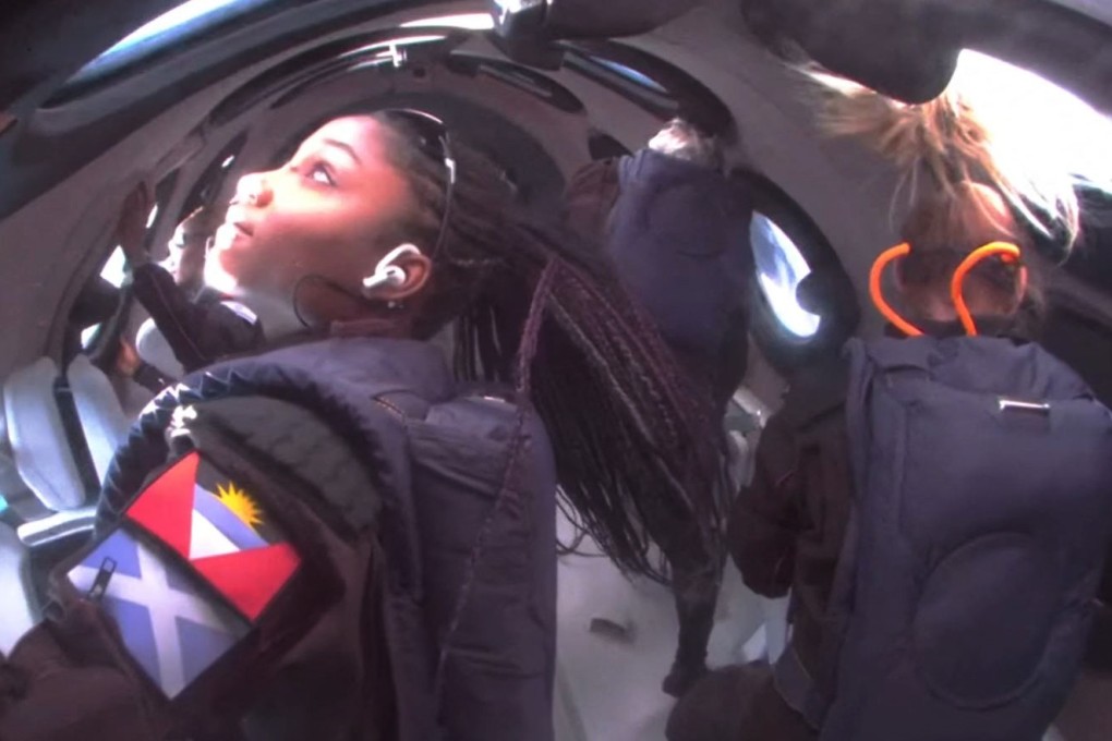 A still from a video from Virgin Galactic on August 10, 2023, with Anastatia Mayers (front left), 18, Jon Goodwin (back right), 80, and Chief Astronaut Instructor Beth Moses (front right) in space. Virgin Galactic had been selling seats on its forthcoming Delta spacecraft at about US$600,000 a seat. In 2026, it plans to charge more. Photo: Virgin Galactic/AFP