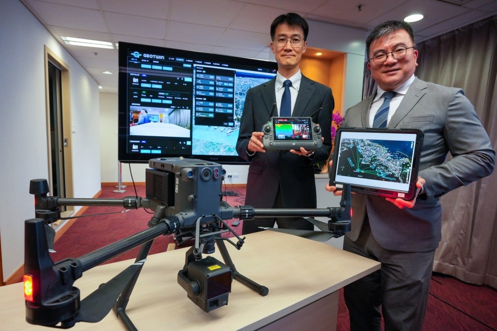 Lawrence Shum (left) of the Geotechnical Engineering Office and Jeffrey Wong, chief geotechnical engineer, display drone technology to be used for the slope assessment project. Photo: May Tse