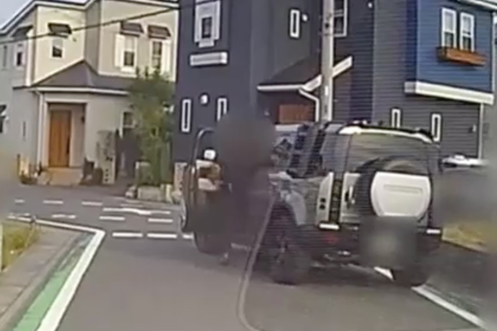 A screen capture from dashcam footage of another car shows the SUV driving away from the scene after allegedly hitting a group of pupils in Misato city in Japan. Photo: Handout