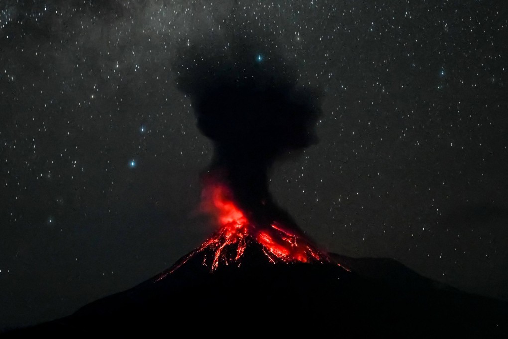Mount Lewotobi Laki-laki erupts on Monday morning, as seen from Pululera village in East Flores, Indonesia. Photo: AFP