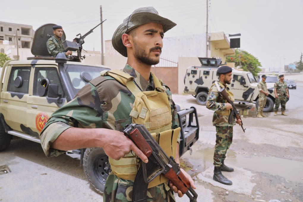 Libyan soldiers at a checkpoint after clashes between heavily armed militias in Tripoli. Photo: AP