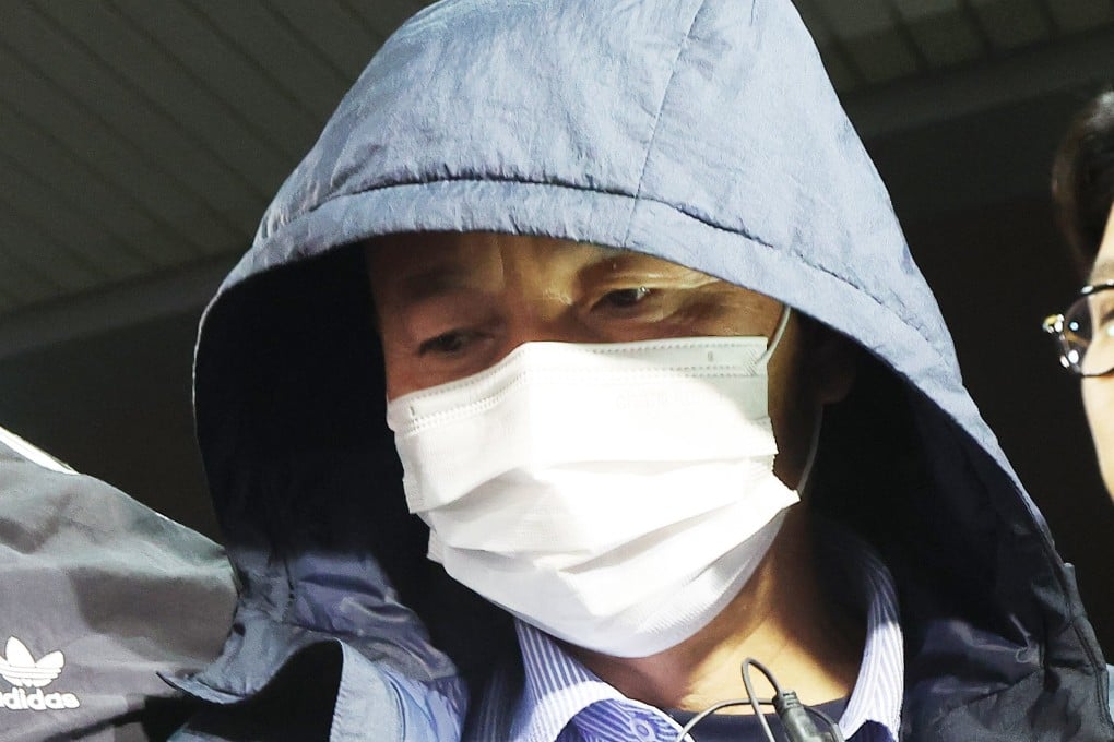 A man suspected of killing two people and seriously injuring two others over the course of several days is taken to a police station in Siheung, southwest of Seoul, South Korea on Monday. Photo: EPA-EFE/Yonhap