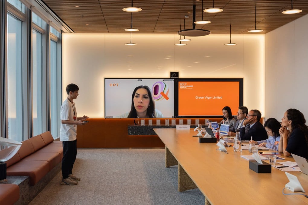 Adrian Li, from Green Vigor, which provides buildings with easy-to-install electricity generating water tanks, makes his business pitch to the panel of jurors during the Jury Deliberation and Finalists Showcase.